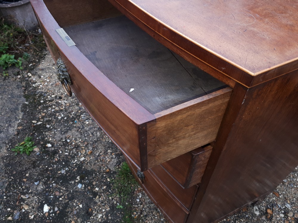 Good practical Regency bow front chest of drawers View IV