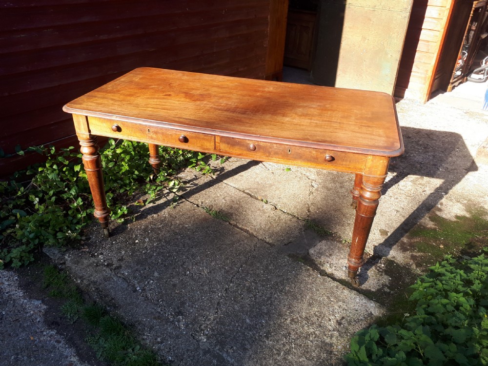 Early Victorian mahogany library writing table of good size.
