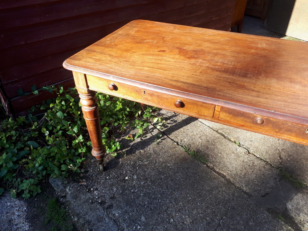 Early Victorian mahogany library writing table of good size. View II