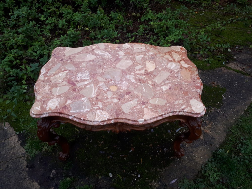Early 20th century marble top coffee table with carved base View II