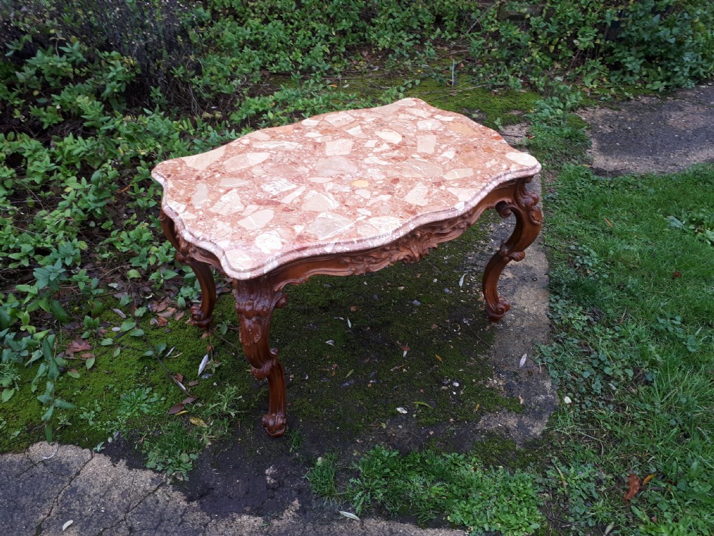 Early 20th century marble top coffee table with carved base View III