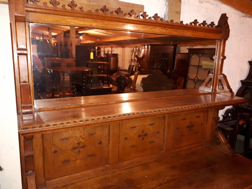 Useful 19th century oak gothic mirror back side cabinet View IV