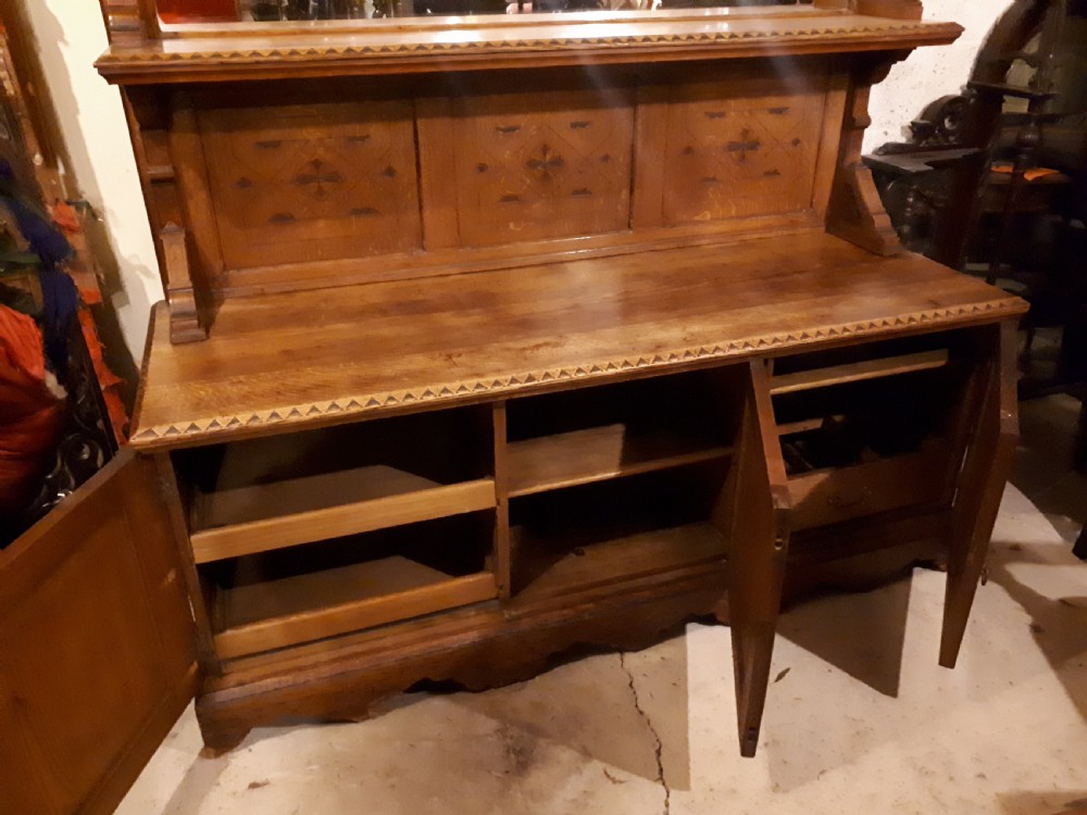 Useful 19th century oak gothic mirror back side cabinet View V