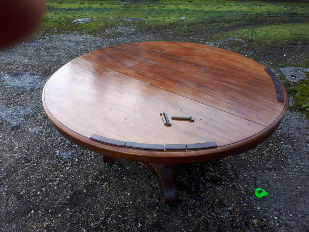 5 foot 8 seater round dining table. View III