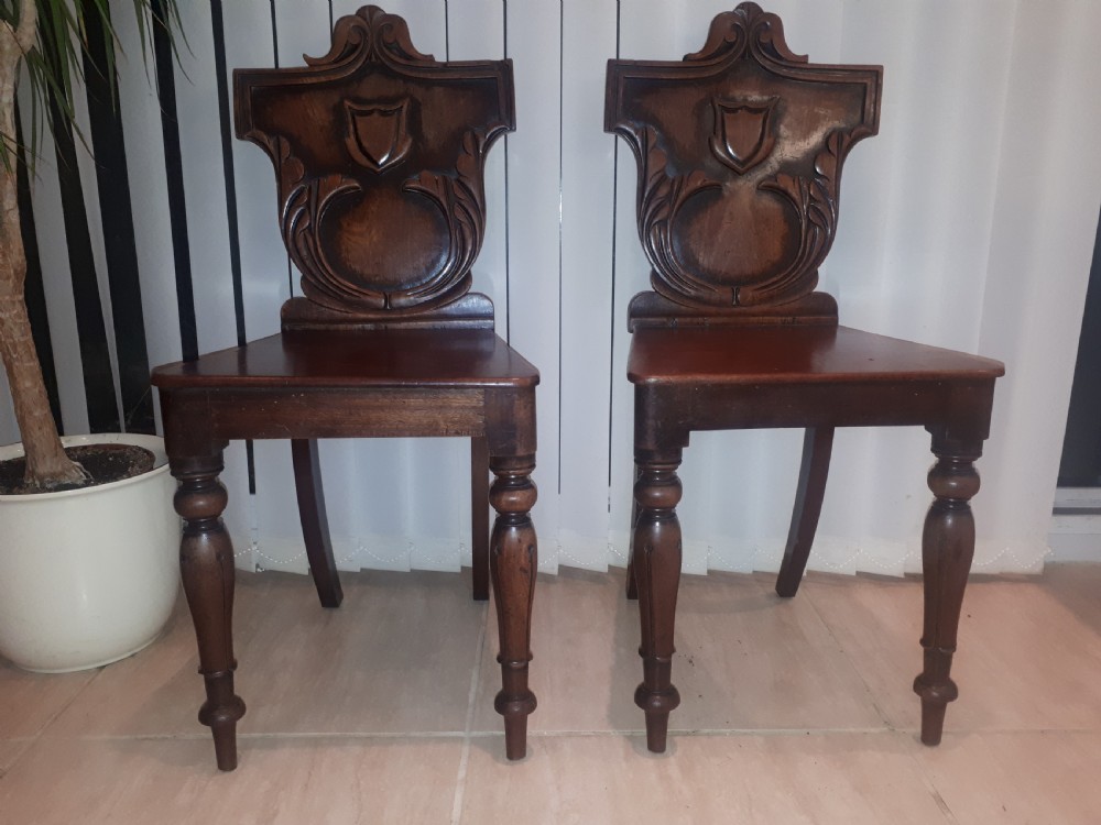 Pair of Recency mahogany hall chairs
