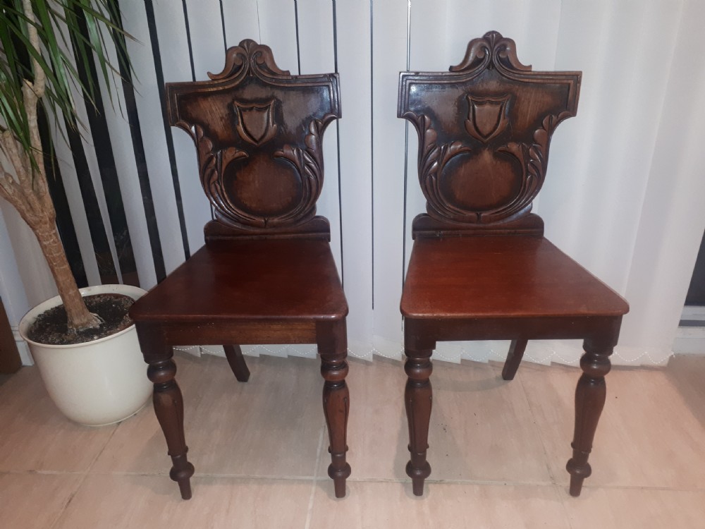 Pair of Recency mahogany hall chairs View II