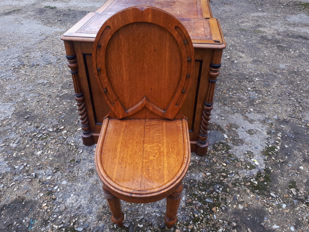 Unusual Mid 19th century oak horse shoe back hall chair. View II