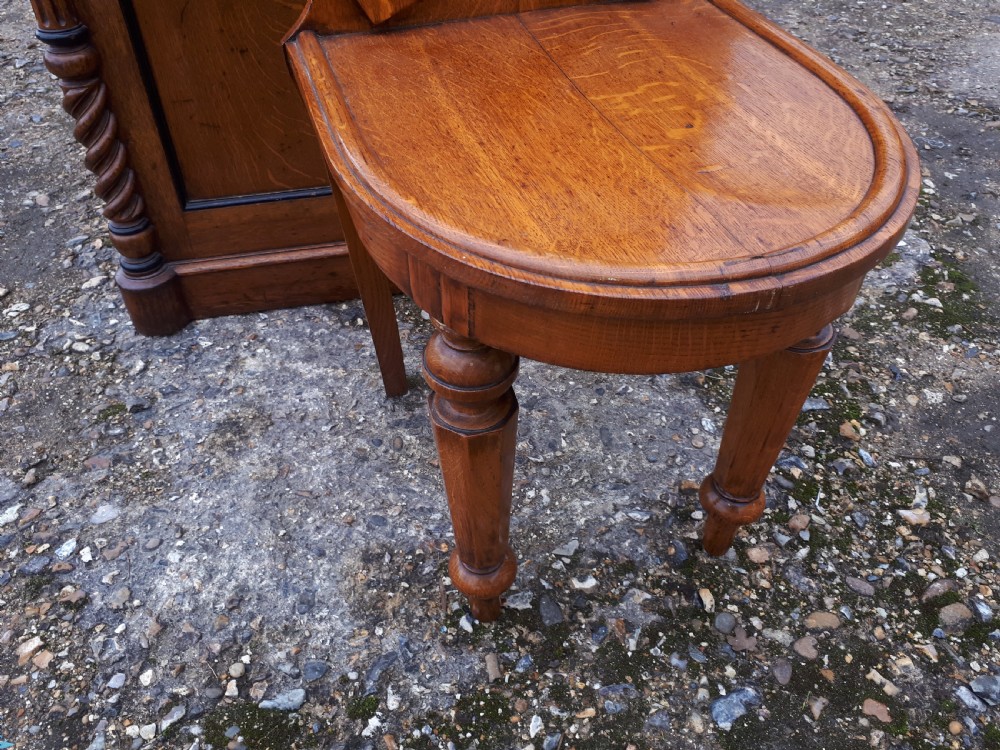 Unusual Mid 19th century oak horse shoe back hall chair. View III