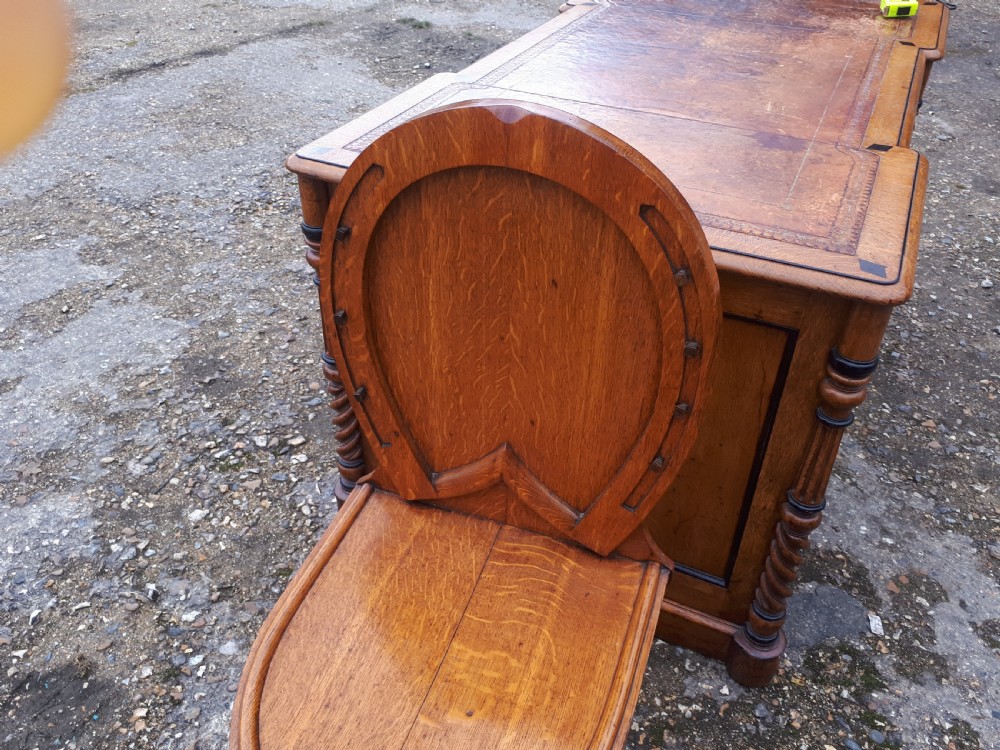 Unusual Mid 19th century oak horse shoe back hall chair. View V