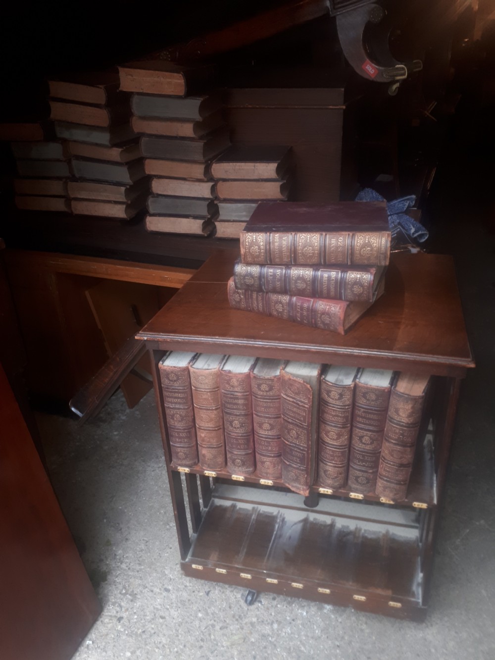 Encyclopedia Britannica revolving bookcase with a complete set of books