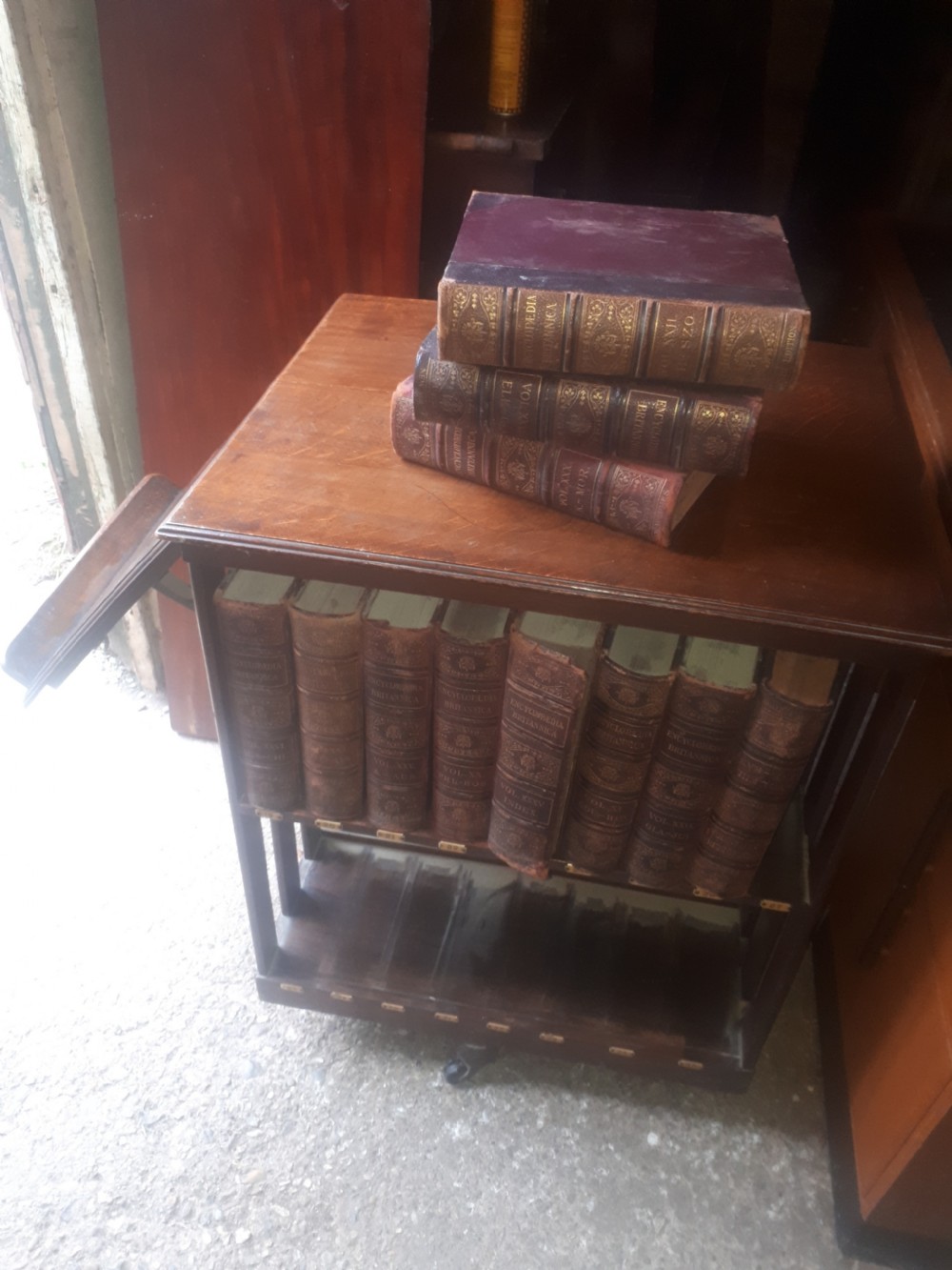 Encyclopedia Britannica revolving bookcase with a complete set of books View II