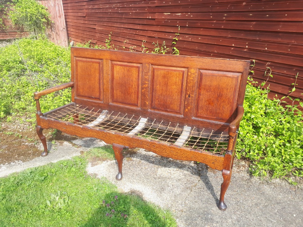 Late Georgian panelled back oak hall seat. View II