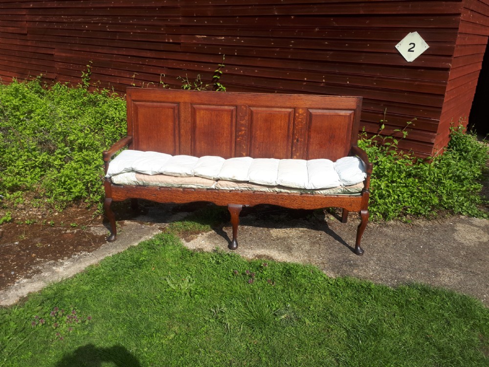 Late Georgian panelled back oak hall seat. View III