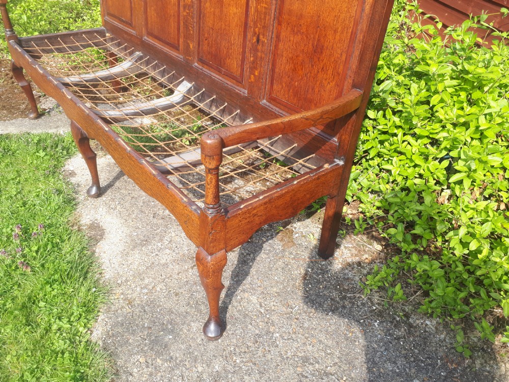 Late Georgian panelled back oak hall seat. View IV