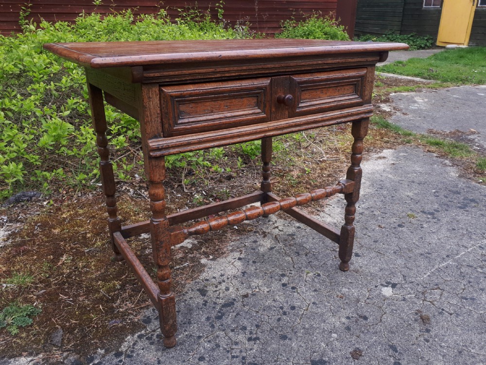 An antique oak side table featuring a single moulded drawer, turned legs, and lower stretchers. View II