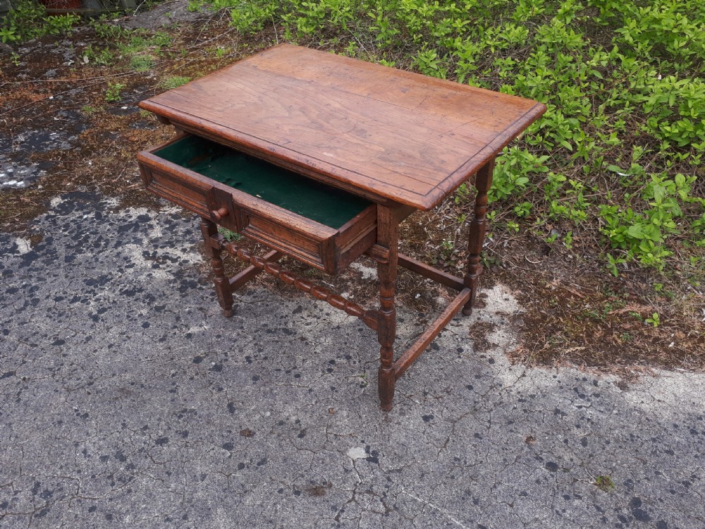 An antique oak side table featuring a single moulded drawer, turned legs, and lower stretchers. View IV