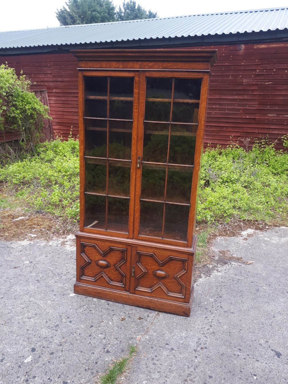 Waring & Gillow oak bookcase cabinet.