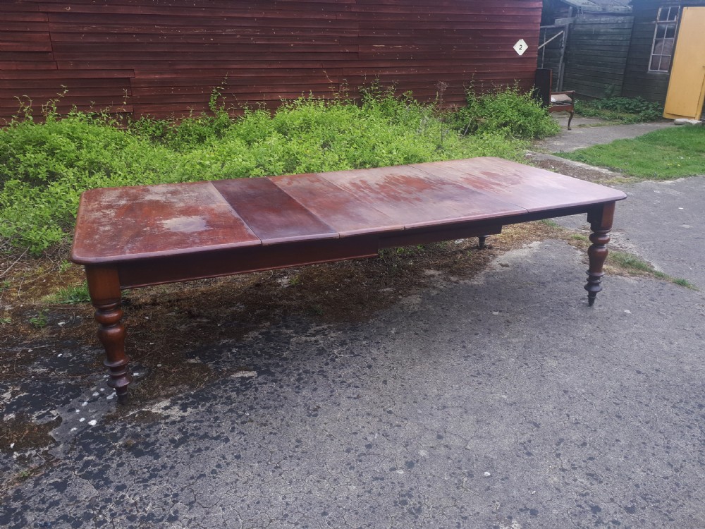 Large early Victorian mahogany extending dining table .