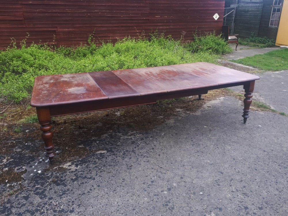 Large early Victorian mahogany extending dining table . View III
