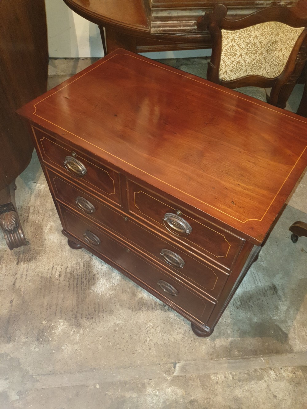Pretty small Regency chest of drawers View II