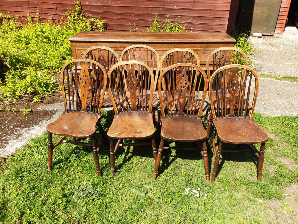 8 early 20th century Windsor wheel back kitchen chairs