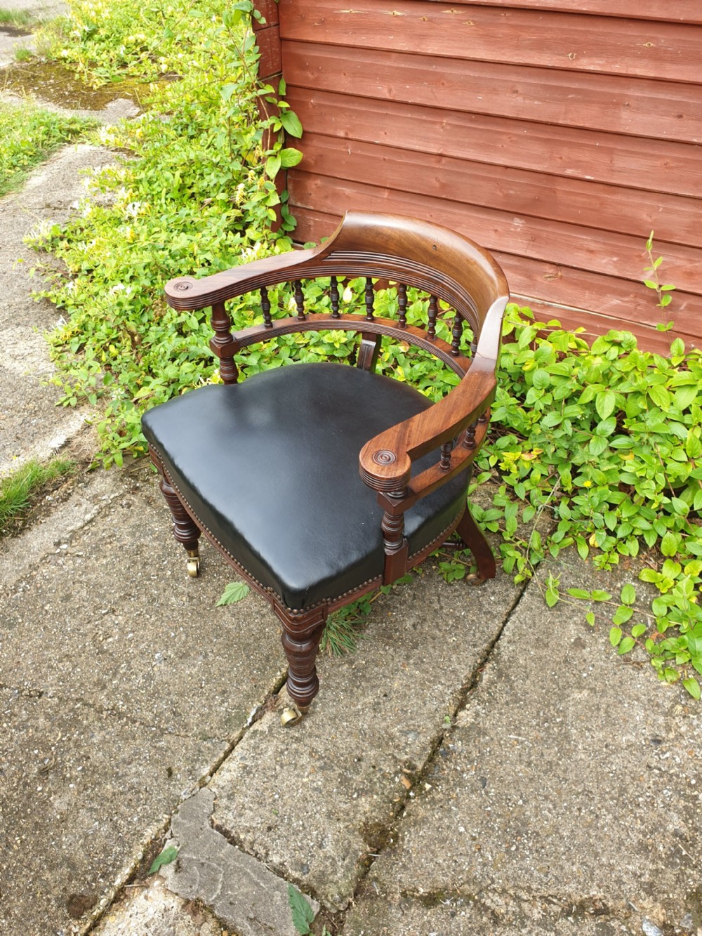 Late Victorian mahogany desk armchair with makers stamp.  View II