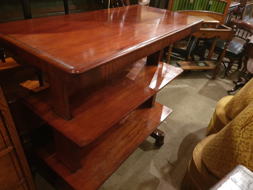 An early Victorian three-tier mahogany adjustable buffet featuring rectangular polished wooden shelves resting on a sturdy pedestal base. View III