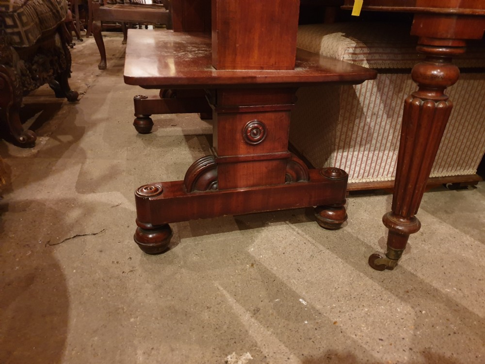 An early Victorian three-tier mahogany adjustable buffet featuring rectangular polished wooden shelves resting on a sturdy pedestal base. View VI