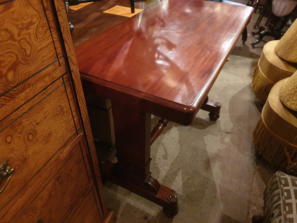 An early Victorian three-tier mahogany adjustable buffet featuring rectangular polished wooden shelves resting on a sturdy pedestal base. View VII