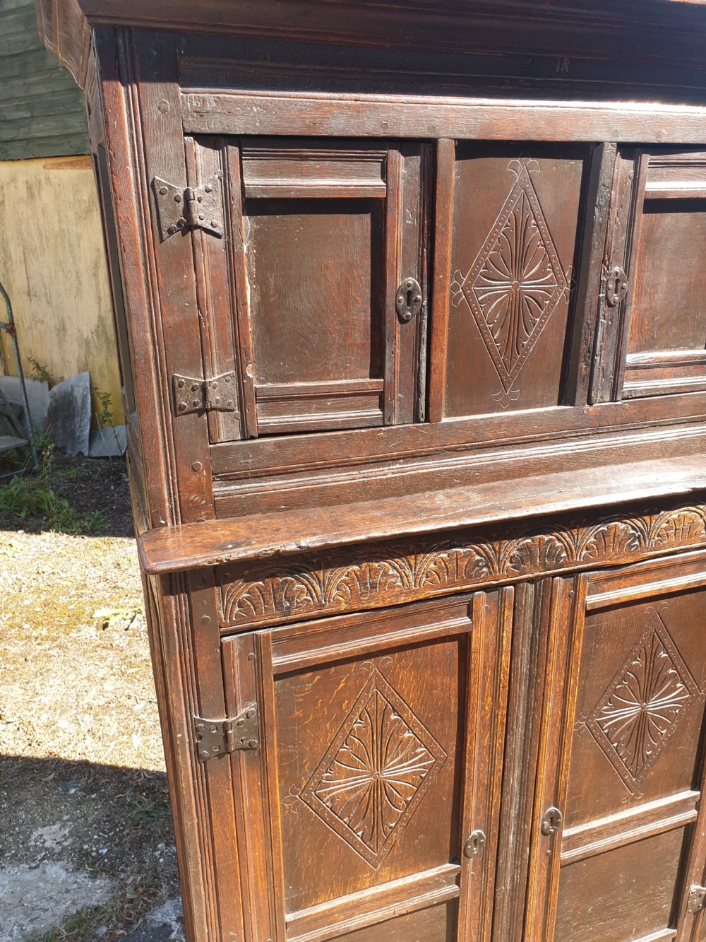 Neat and useful antique carved oak hall cupboard . View VI