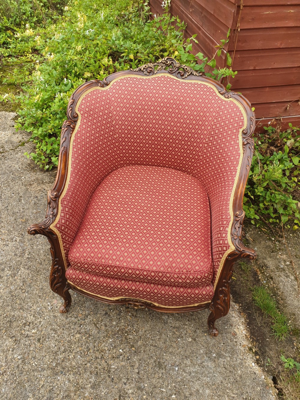 Good deep comfortable upholstered armchair.  View III
