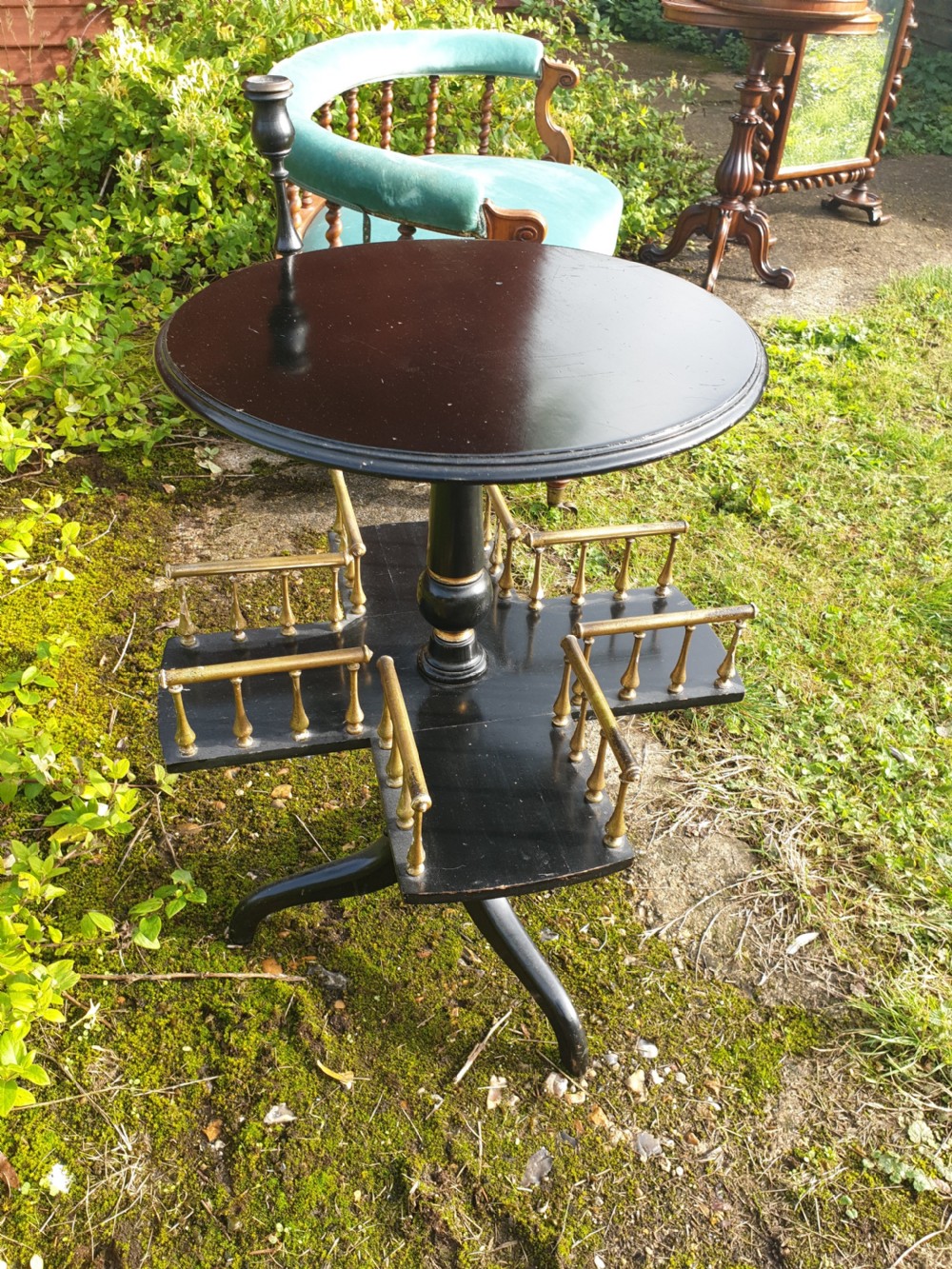 Late Victorian ebonised and gilt revolving occasional table View III