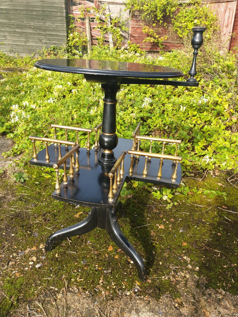Late Victorian ebonised and gilt revolving occasional table View IV