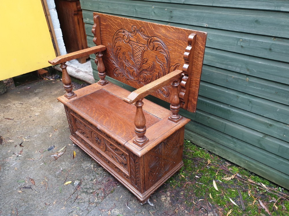 Carved oak fold over top monks hall seat View II