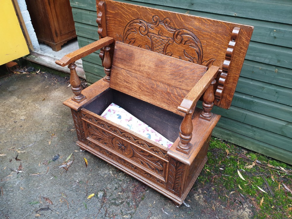 Carved oak fold over top monks hall seat View III