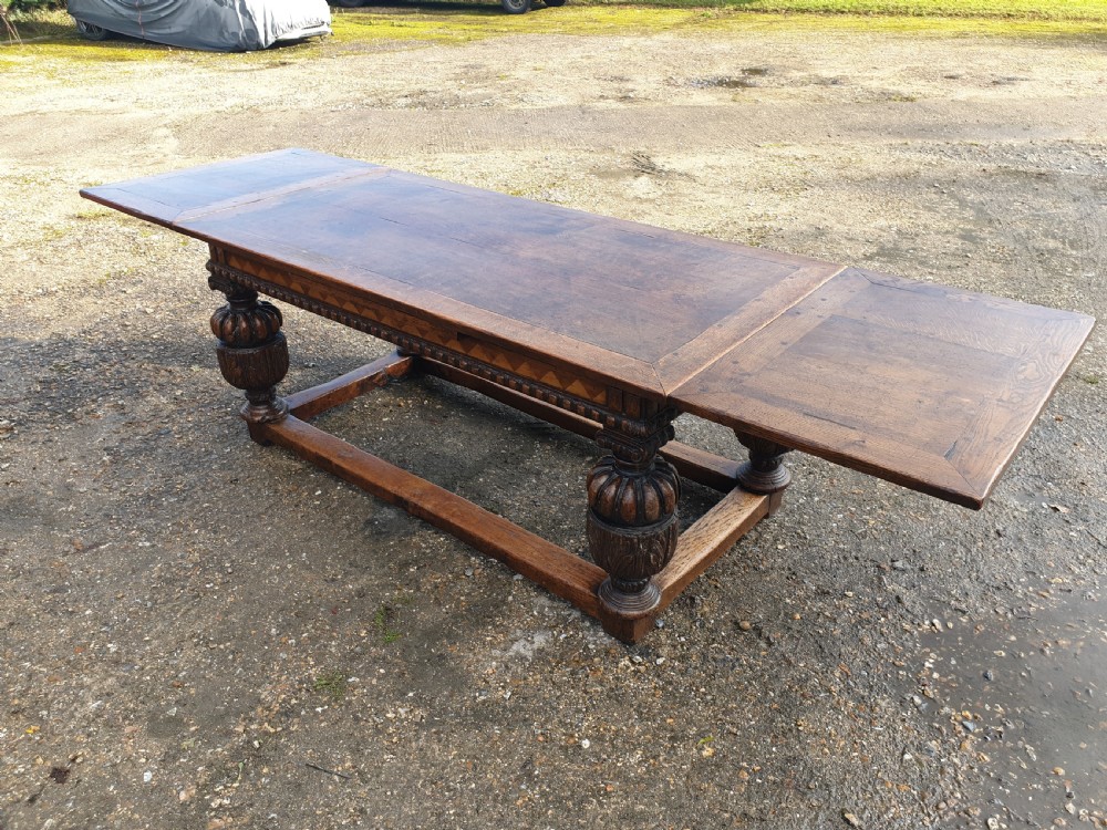 Large carved oak draw leaf refectory dining table.  View X