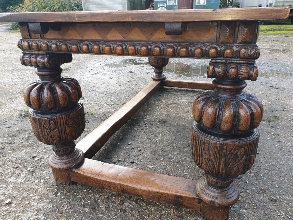 Large carved oak draw leaf refectory dining table.  View XI