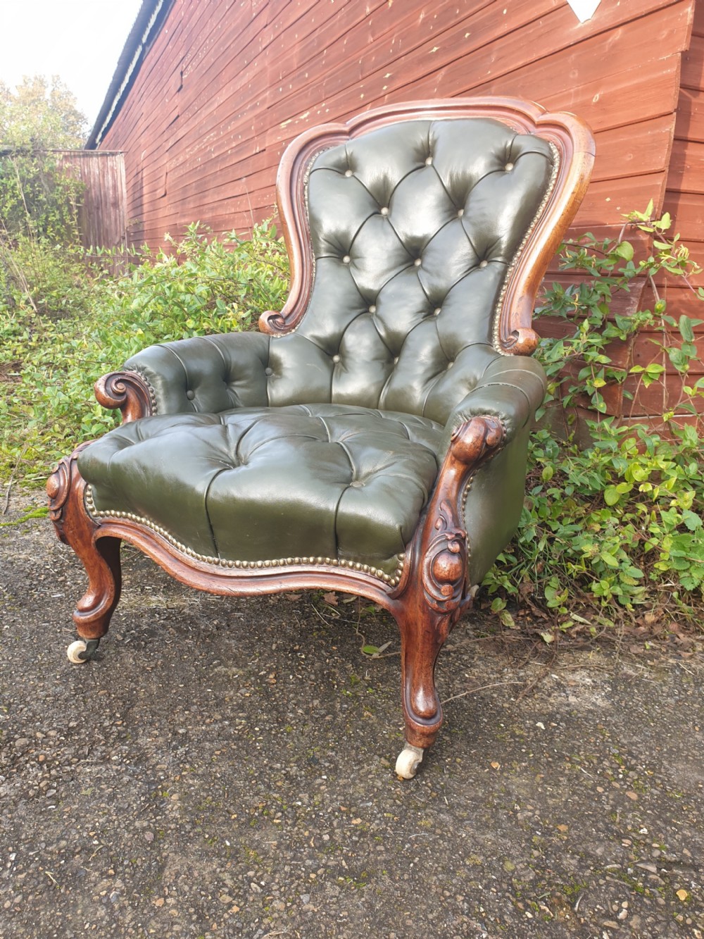 Victorian mahogany frame leather upholstered library armchair 