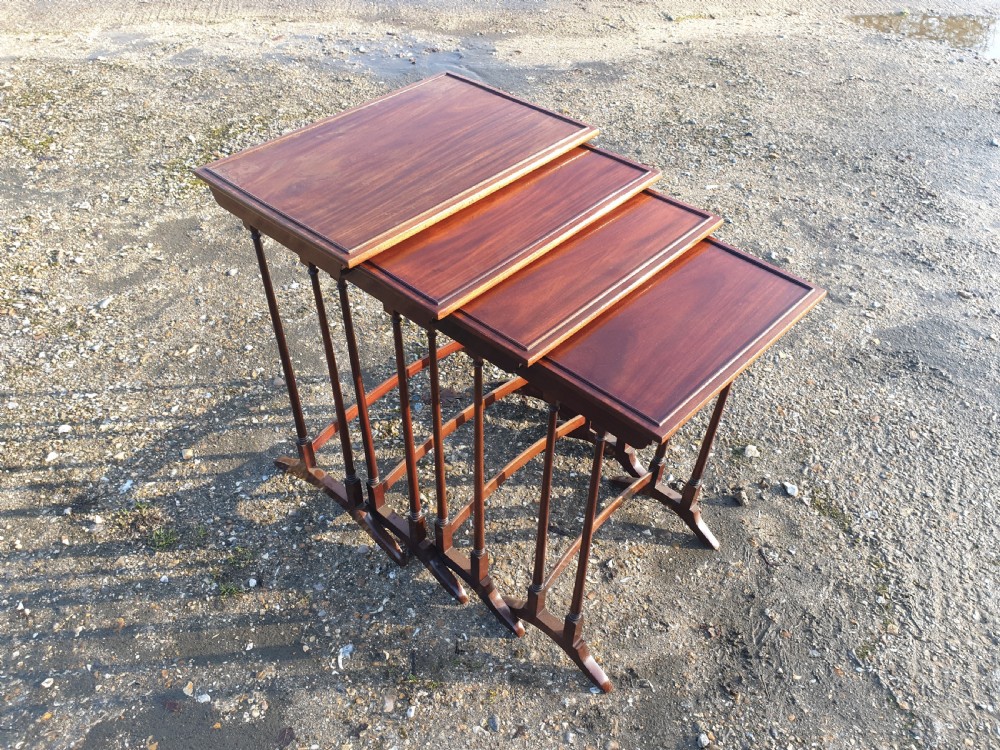 Nest of 4 Edwardian mahogany occasional tables. 
