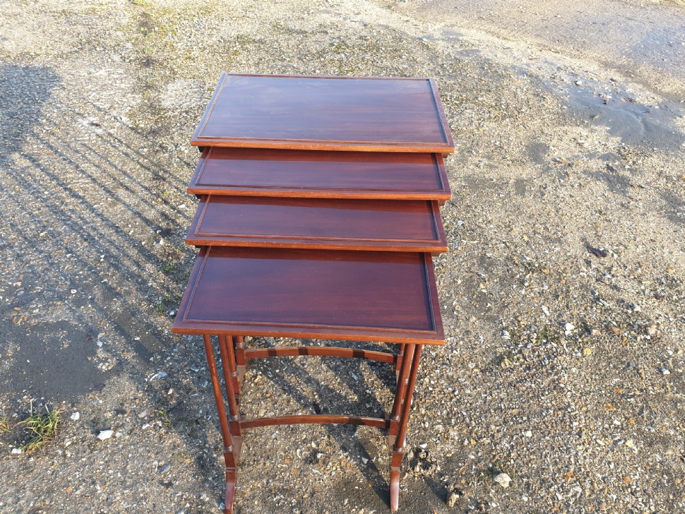 Nest of 4 Edwardian mahogany occasional tables.  View II