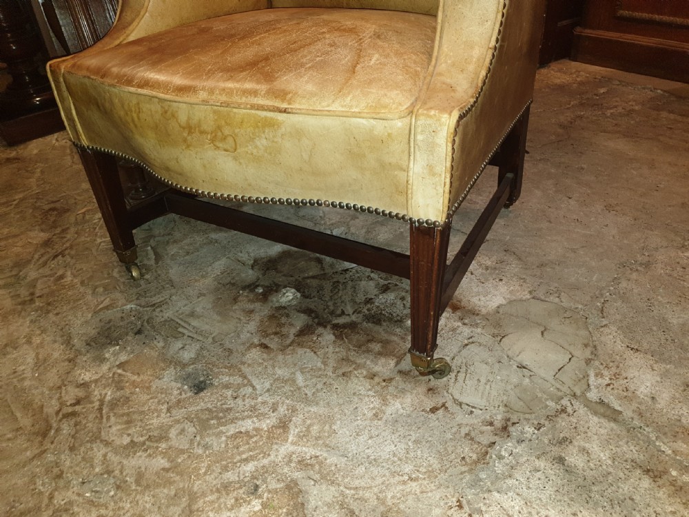 Good shaped leather wing back armchair  View II