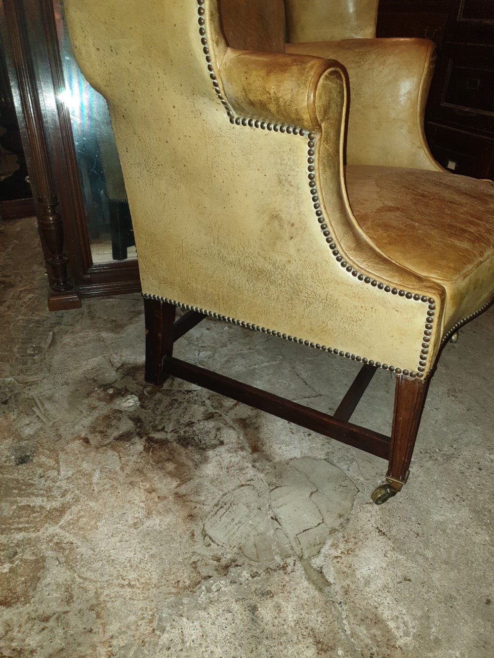 Good shaped leather wing back armchair  View IV