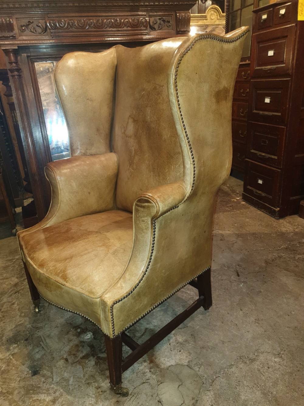 Good shaped leather wing back armchair  View V