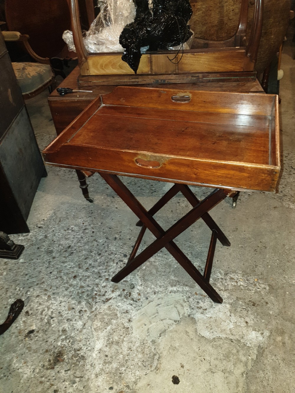 Mid Victorian mahogany butlers tray on folding stand  