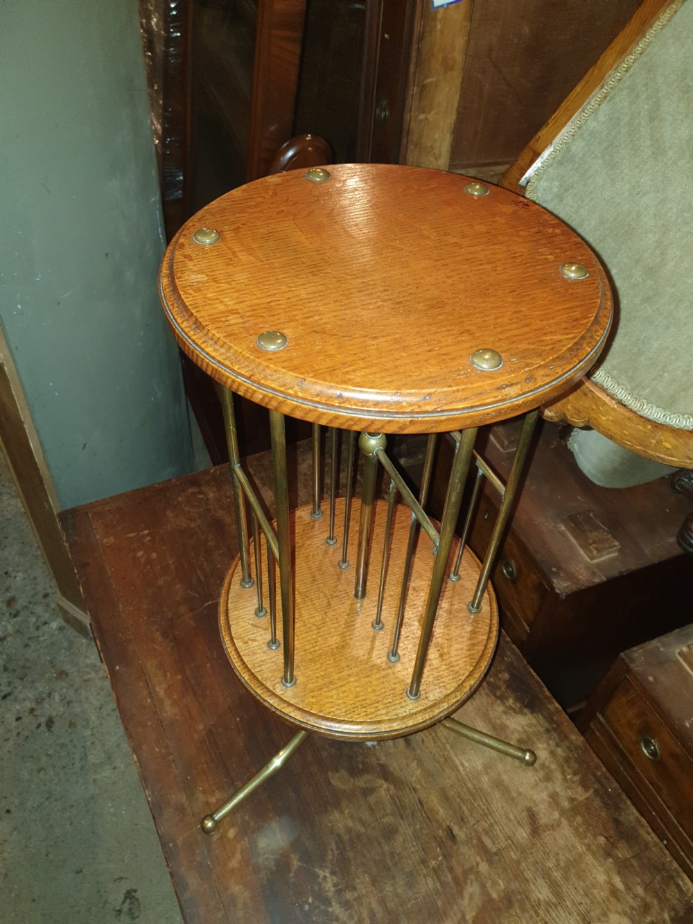 Good oak and brass magazine revolving stand