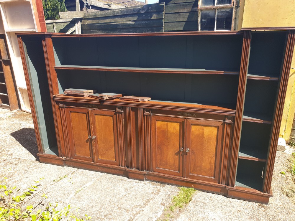 Useful long Victorian open front bookcase with cupboards.  View II