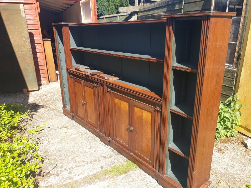 Useful long Victorian open front bookcase with cupboards.  View VI