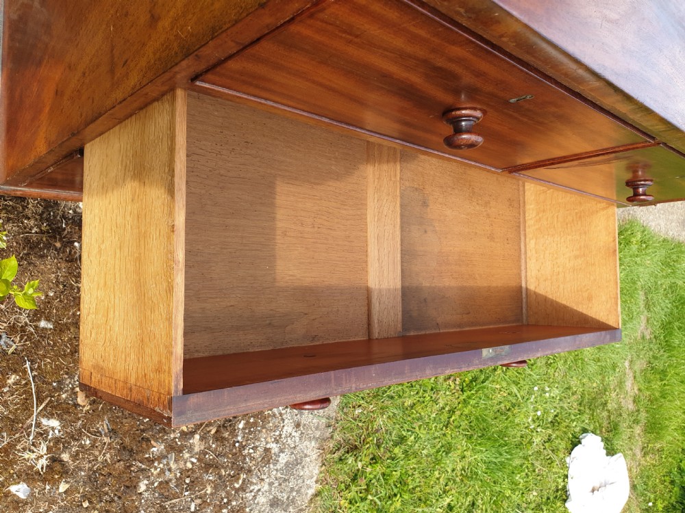 Neat and practical early Victorian mahogany chest of drawers.  View III