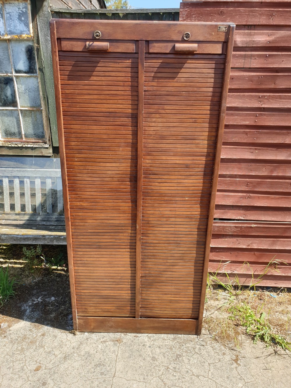 Early 20th century double tambour front cabinet. 
