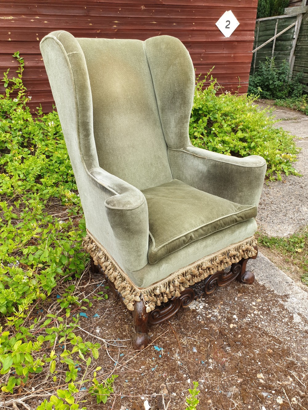 Upholstered wing back armchair of Queen Anne design.  View III